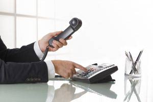 Businessman Hands Dialing Out