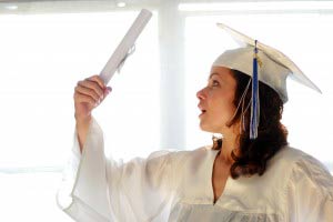 Happy young woman, just graduated with diploma